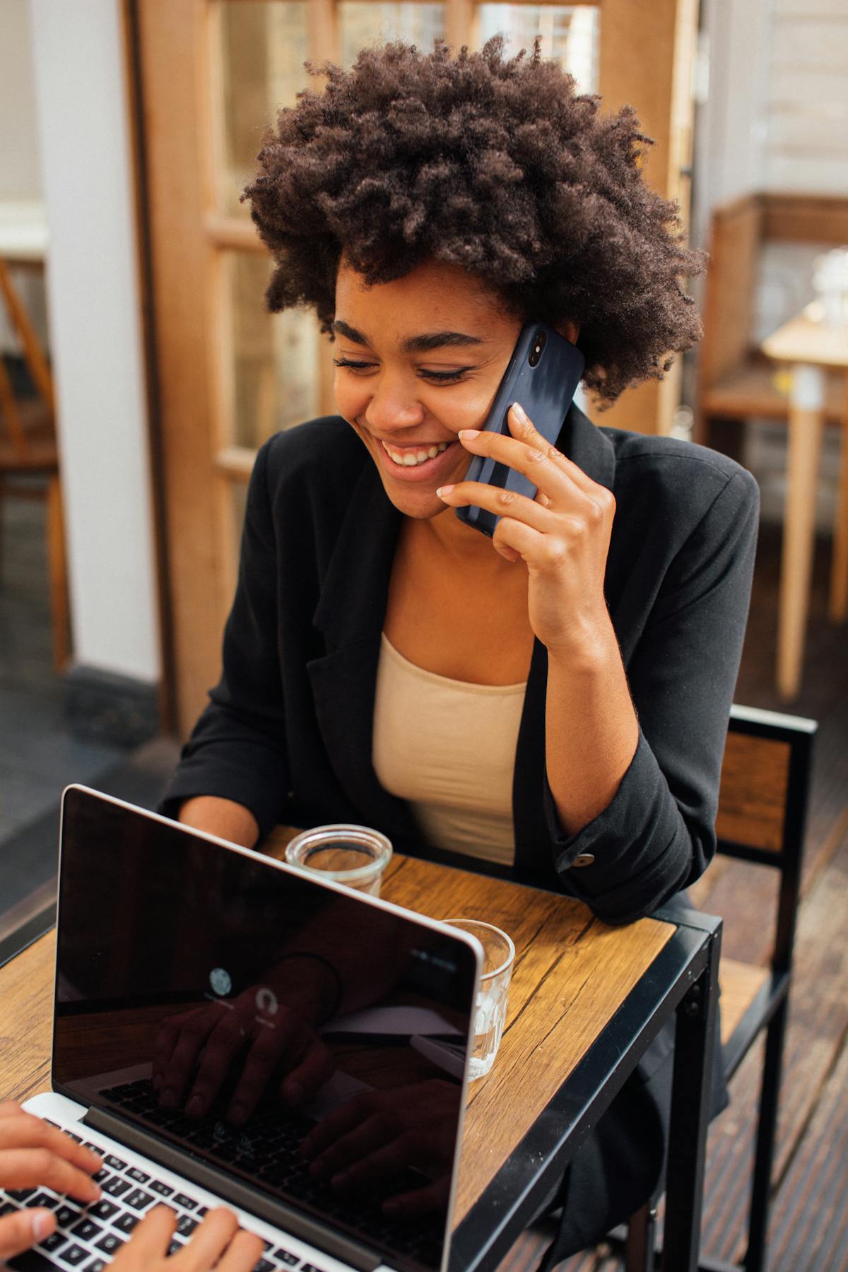 Smiling business woman using a smartphone